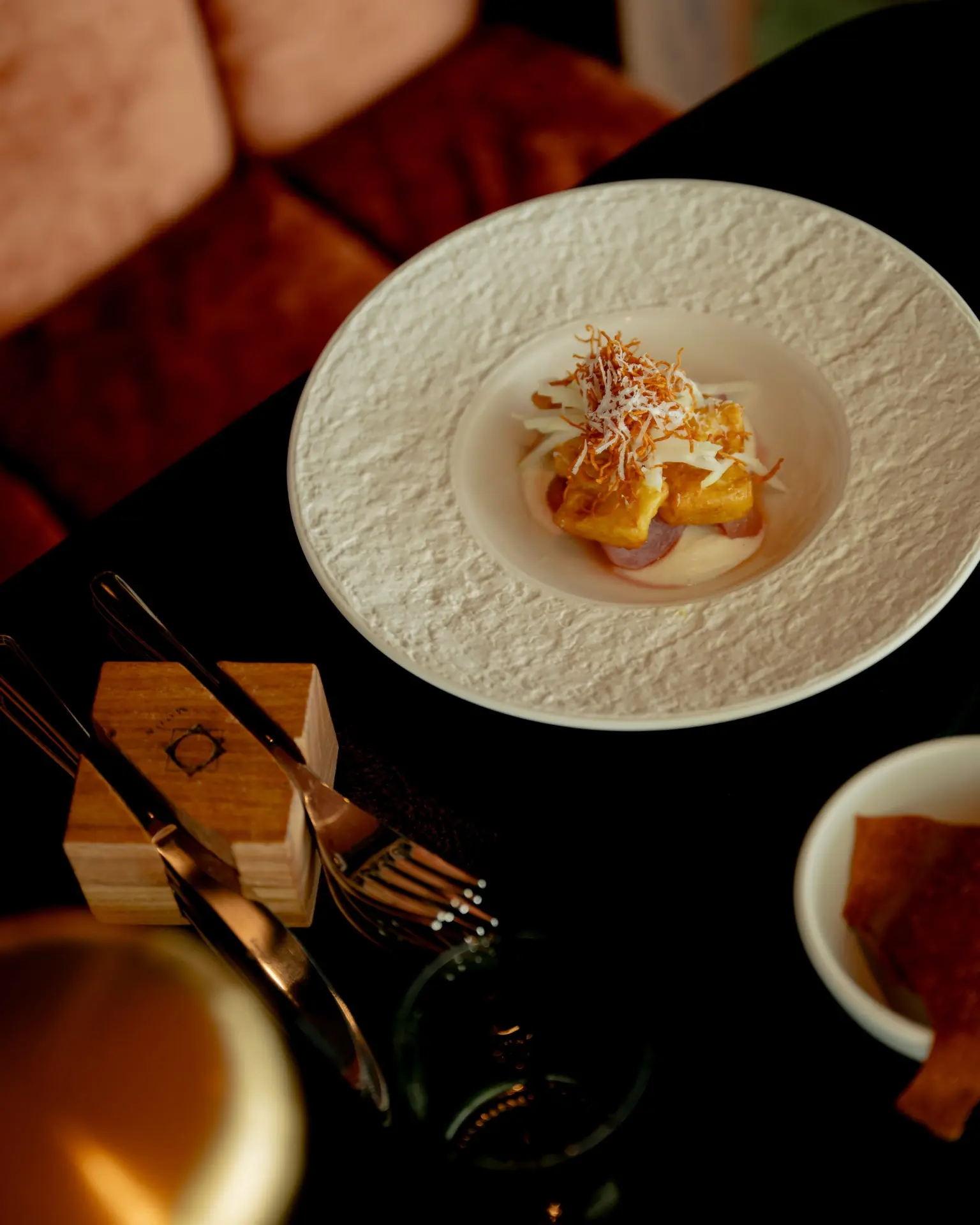 A plated dish on the table at MOON Amsterdam