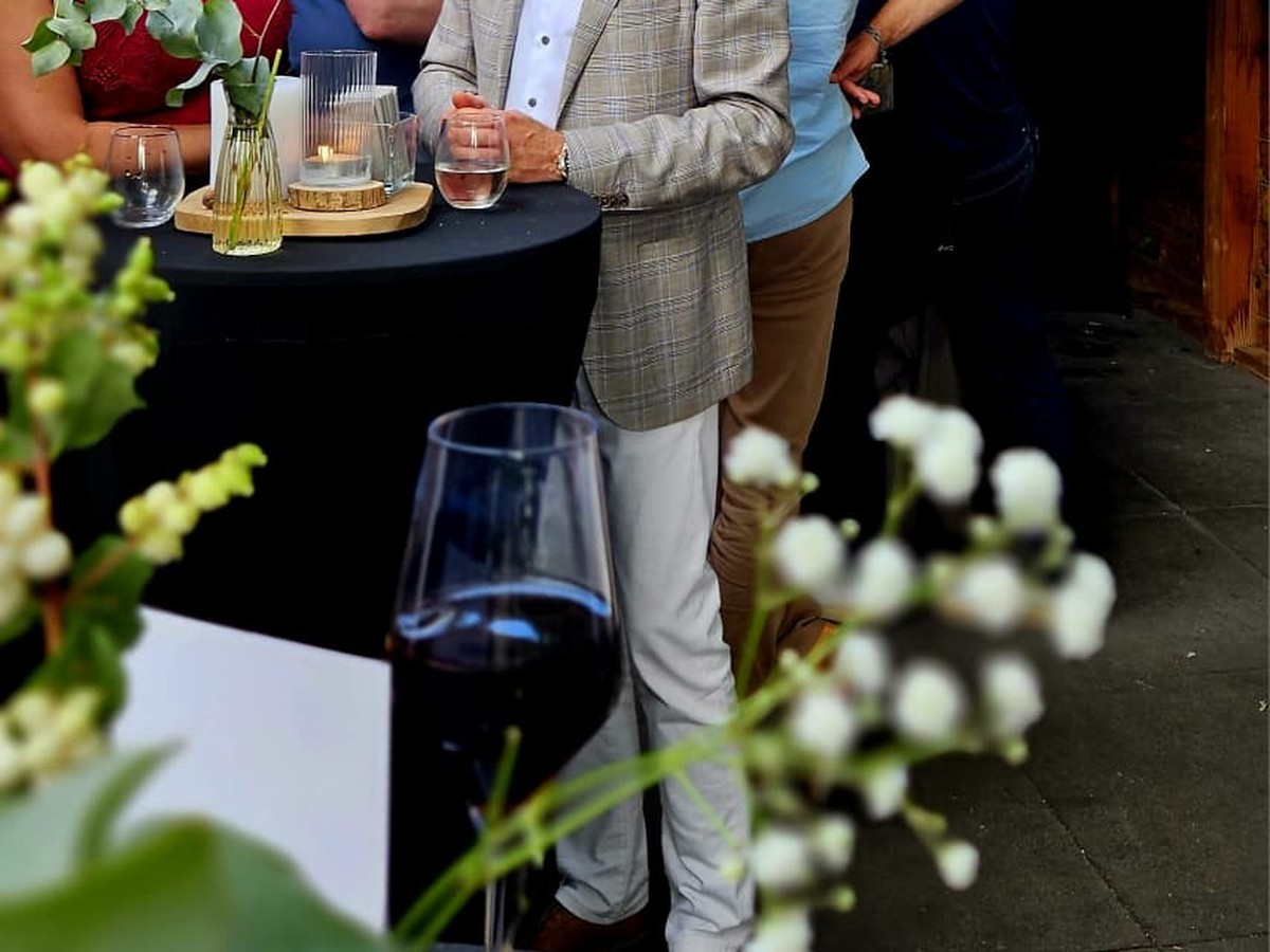 Table setting with wine glasses and flowers during the reception of The First Fire at The Residence