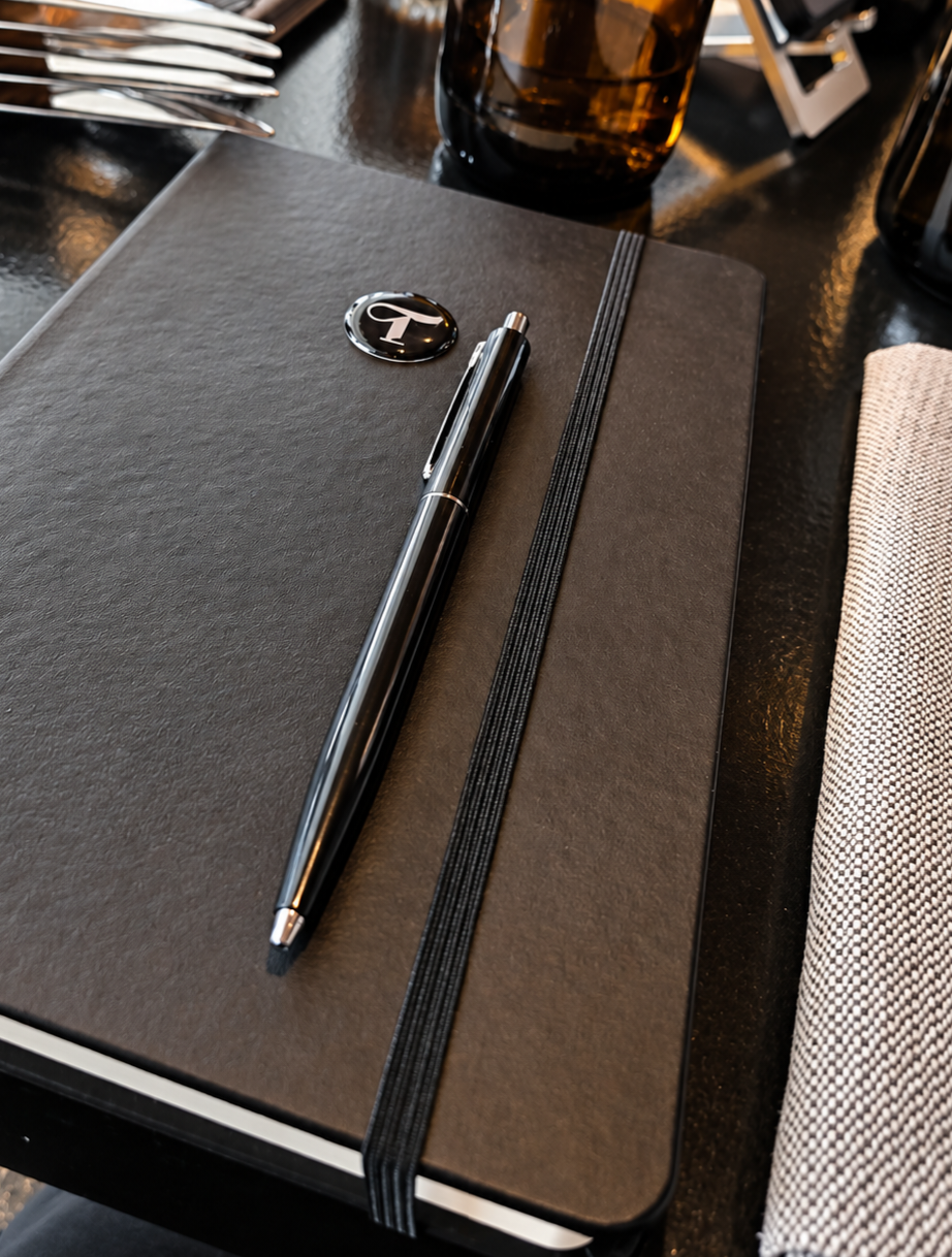 A Tier¹ notebook and pen on the lunch table at MOON Amsterdam